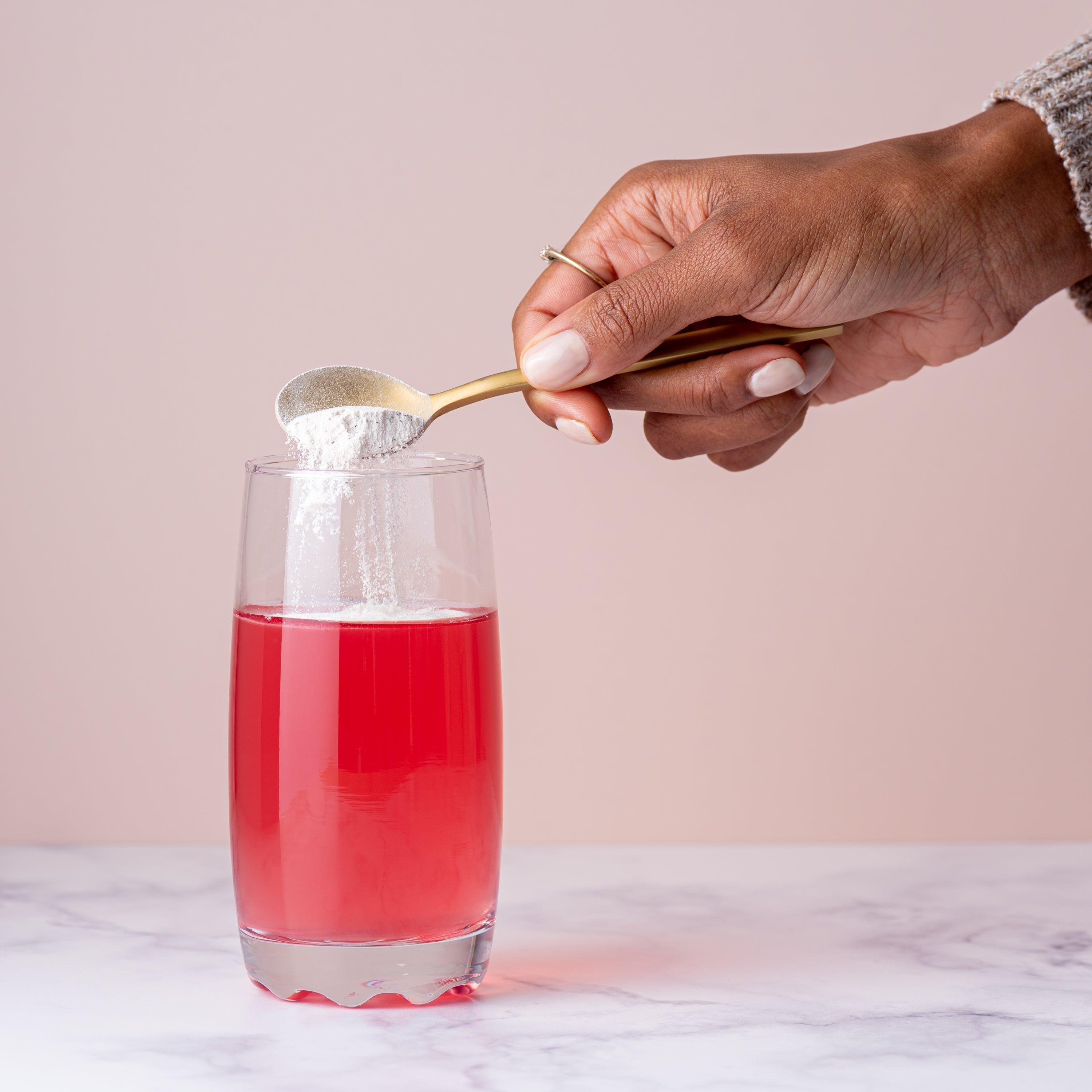 Glass of marine collagen peptides mixed with water