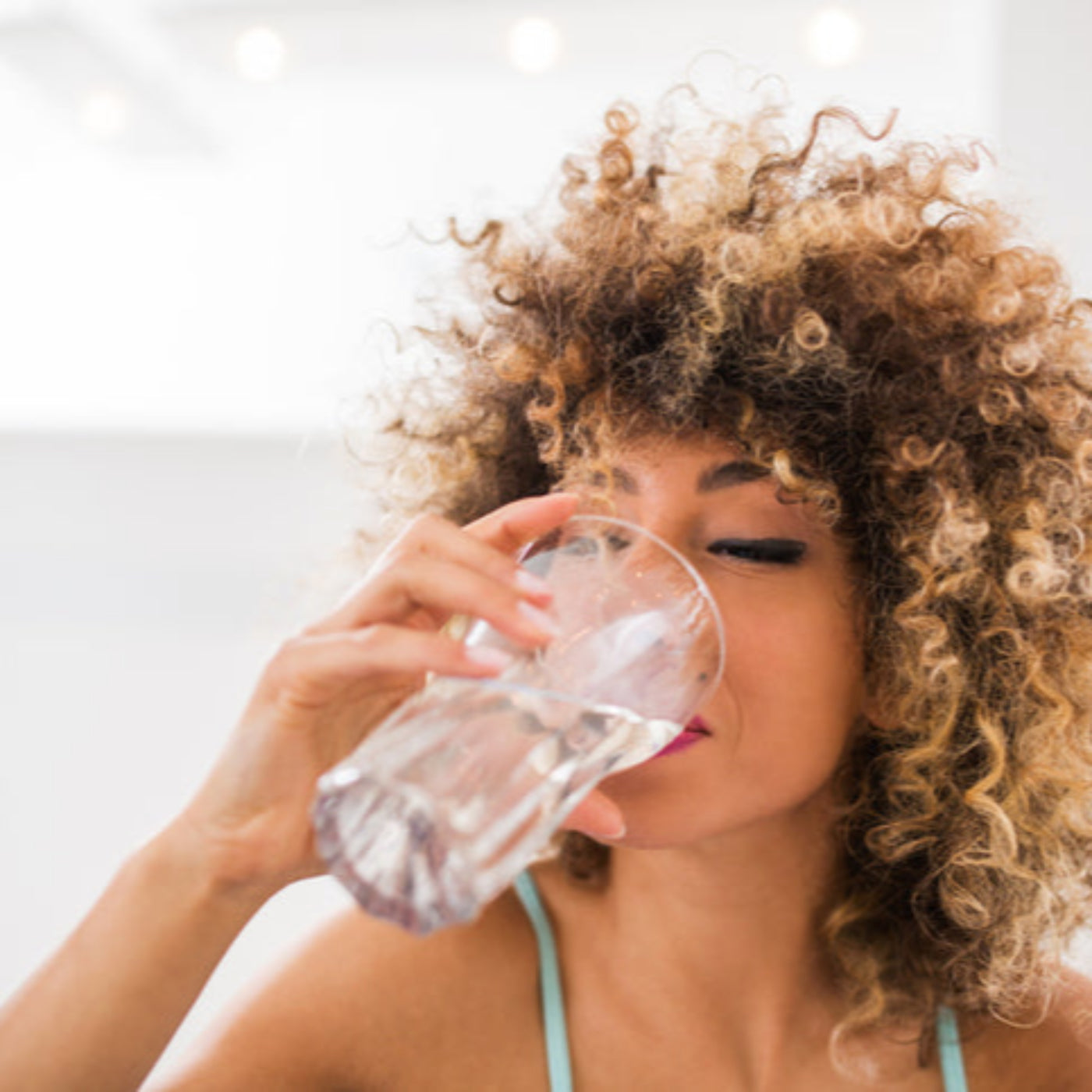 woman drinking glass of water